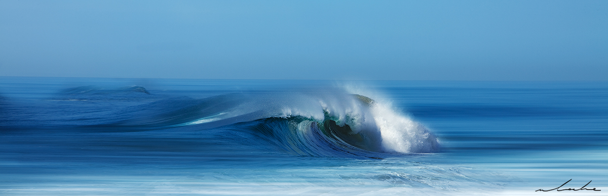 Colour Photograph of a wave breaking